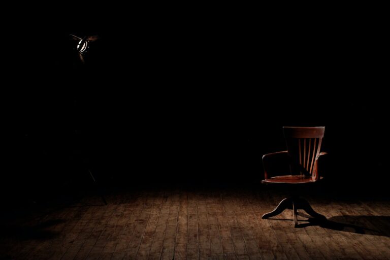 brown wooden armchair on brown wooden floor